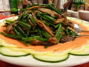 Shredded duck with flowering chives